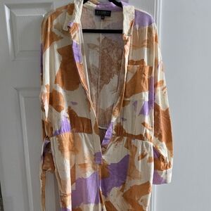 Eloquii Orange and Cream Jumpsuit with Artistic Flair